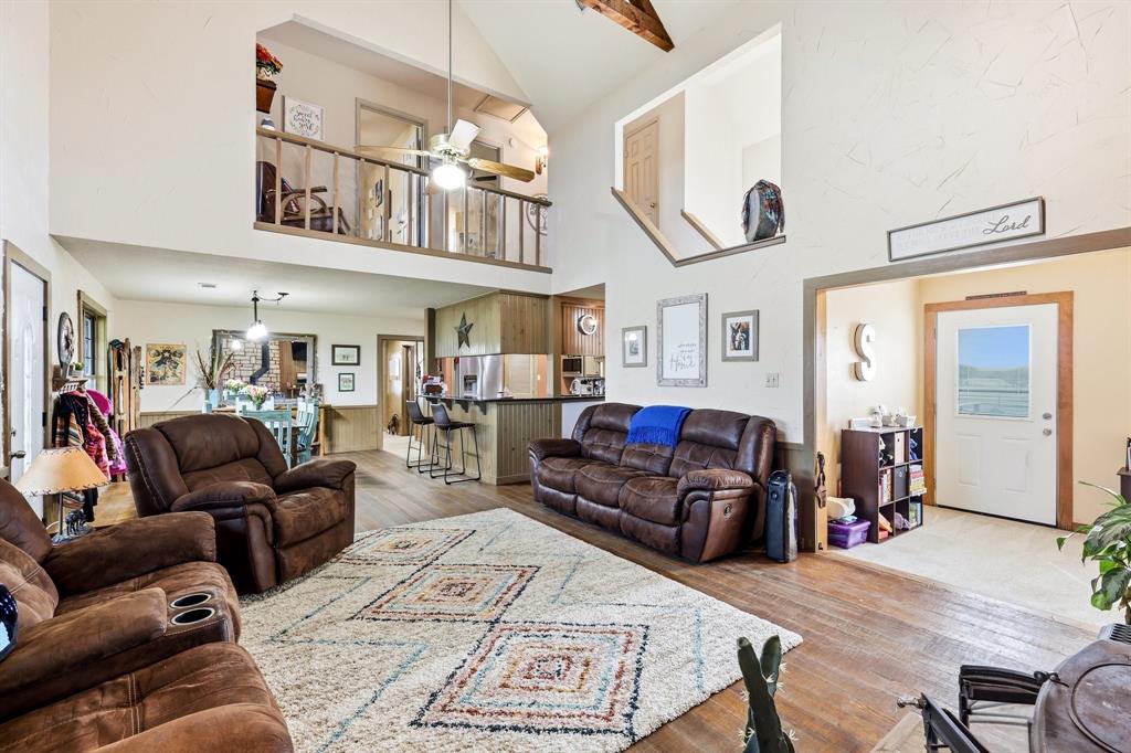 309 Sanders Road Denton, TX 76210 - Photo 7 of 40 a living room with furniture and wooden floor