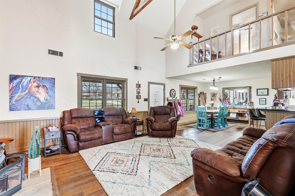 309 Sanders Road Denton, TX 76210 - Photo 9 of 40 a living room with furniture or couch and a large window