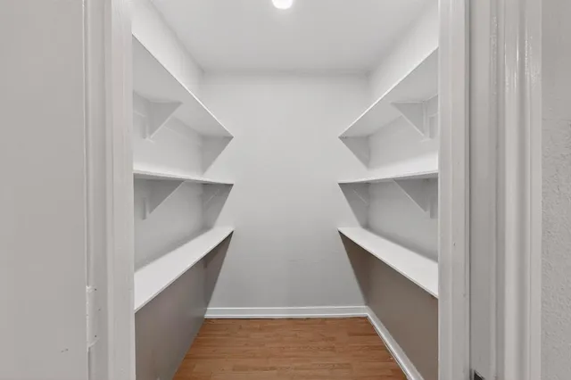 a view of staircase with white walls