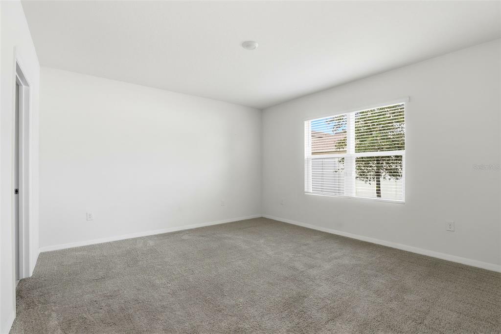 6777 Huntleigh Hammock Road Harmony, FL 34773 - Photo 14 of 32 an empty room with a window