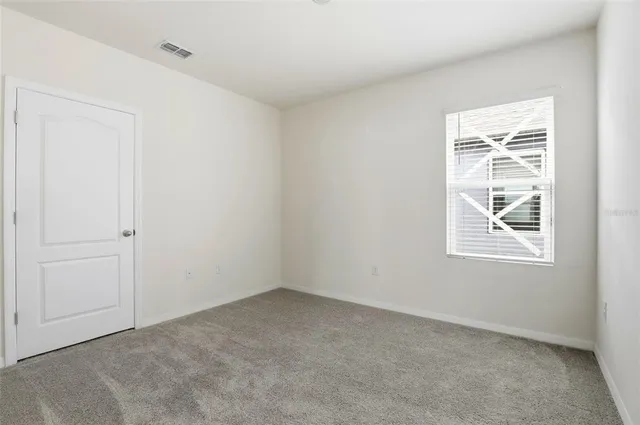a bathroom with a granite countertop toilet a sink and a bathtub