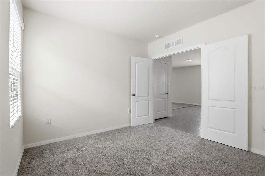 6777 Huntleigh Hammock Road Harmony, FL 34773 - Photo 18 of 32 an empty room with an empty space
