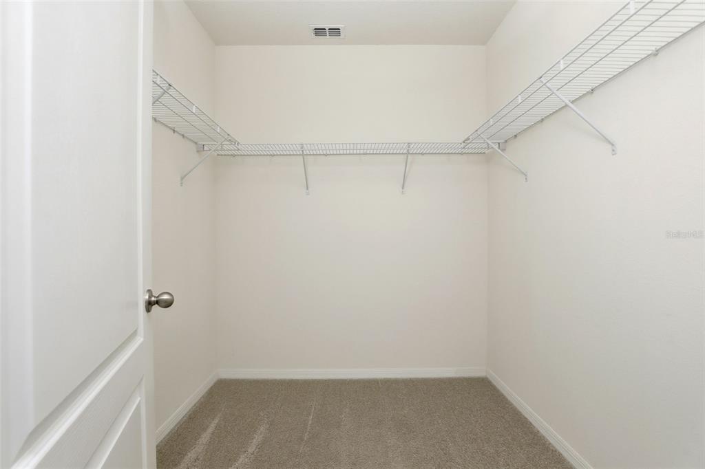 6777 Huntleigh Hammock Road Harmony, FL 34773 - Photo 20 of 32 a view of an empty walk in closet