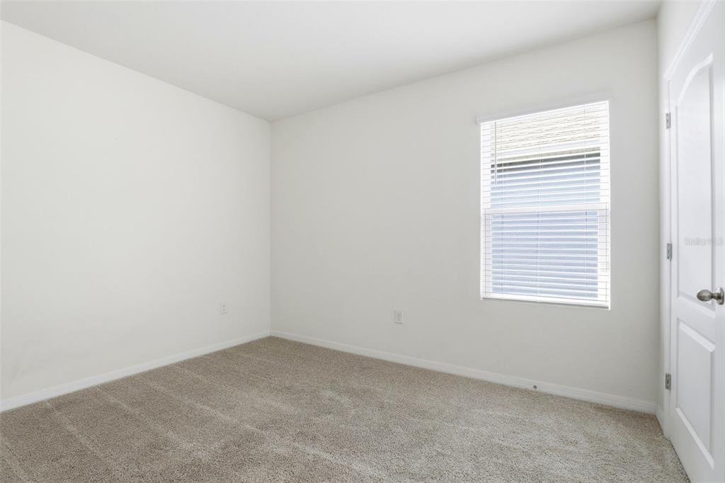 6777 Huntleigh Hammock Road Harmony, FL 34773 - Photo 21 of 32 an empty room with a window