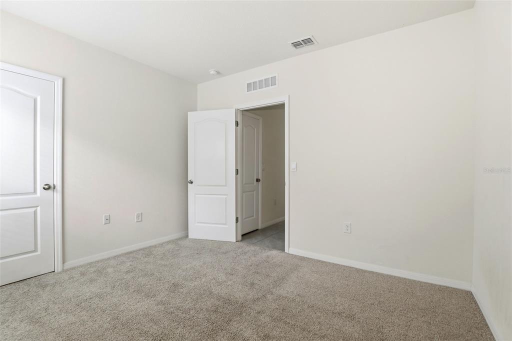 6777 Huntleigh Hammock Road Harmony, FL 34773 - Photo 22 of 32 a view of an empty room