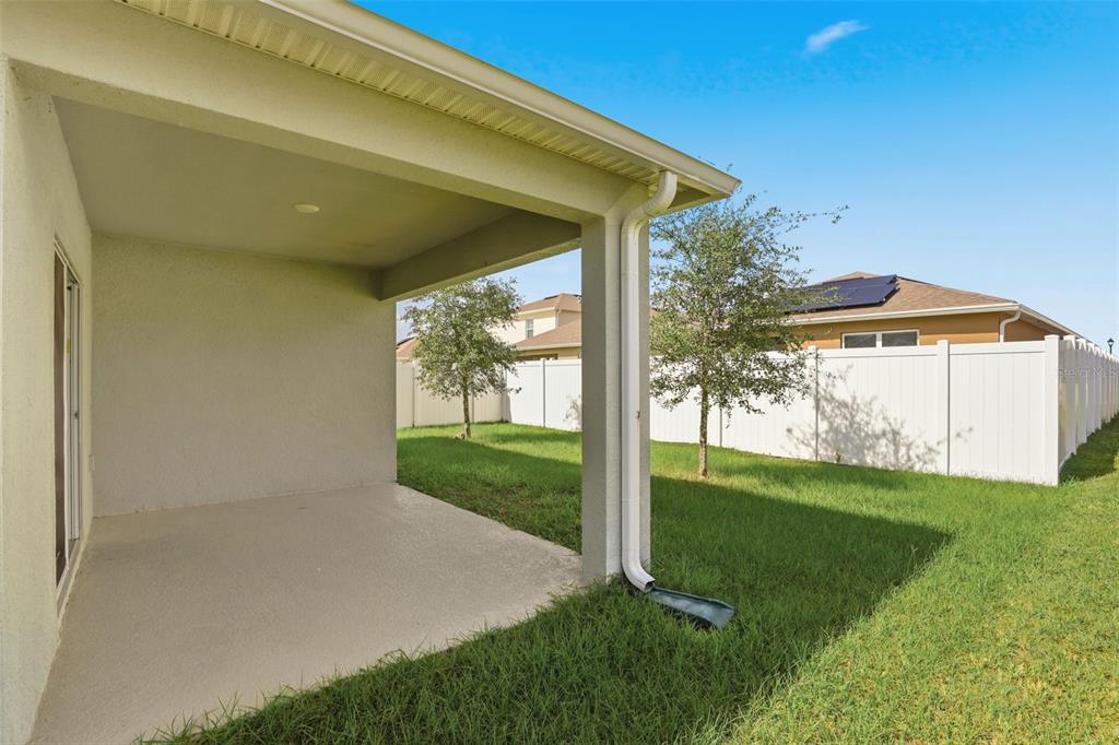 6777 Huntleigh Hammock Road Harmony, FL 34773 - Photo 25 of 32 a view of a back yard of the house