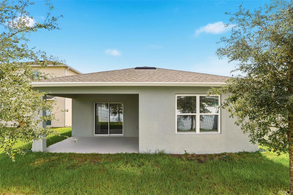 6777 Huntleigh Hammock Road Harmony, FL 34773 - Photo 27 of 32 front view of a house with a yard