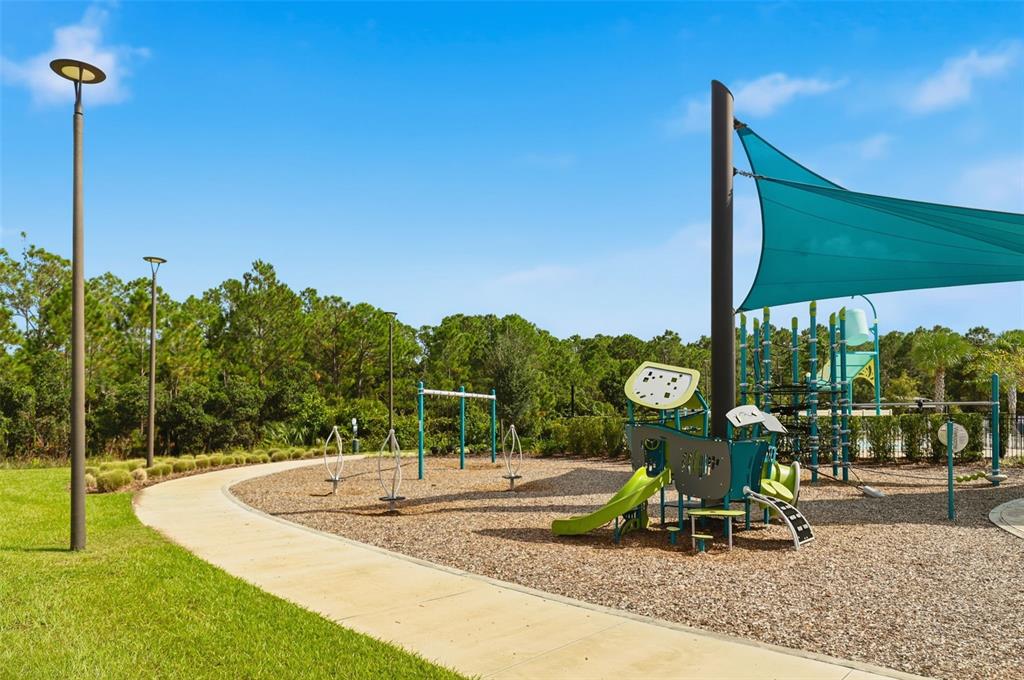 6777 Huntleigh Hammock Road Harmony, FL 34773 - Photo 31 of 32 a view of a park with slide