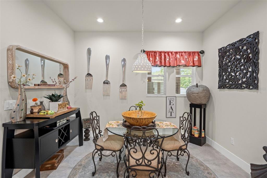 17601 Hanna Road Lutz, FL 33549 - Photo 18 of 48 a dining room with furniture and window