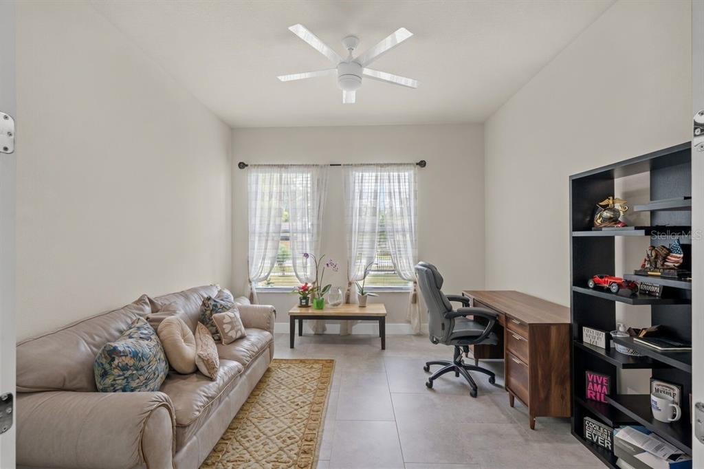17601 Hanna Road Lutz, FL 33549 - Photo 20 of 48 a living room with furniture and a large window