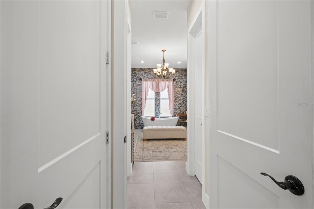 17601 Hanna Road Lutz, FL 33549 - Photo 24 of 48 a view of a bathroom from a hallway