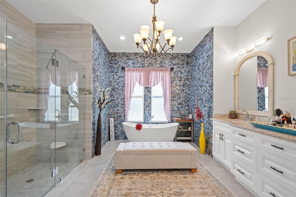 17601 Hanna Road Lutz, FL 33549 - Photo 25 of 48 a spacious bathroom with double vanity and a mirror