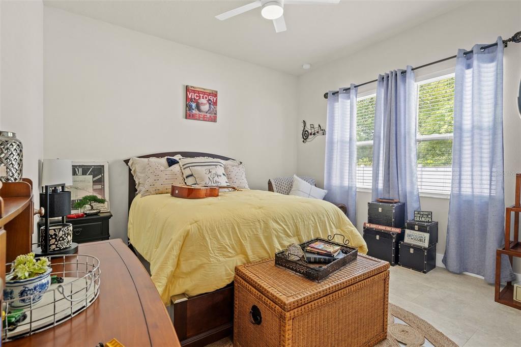 17601 Hanna Road Lutz, FL 33549 - Photo 30 of 48 a bedroom with a bed and wooden floor