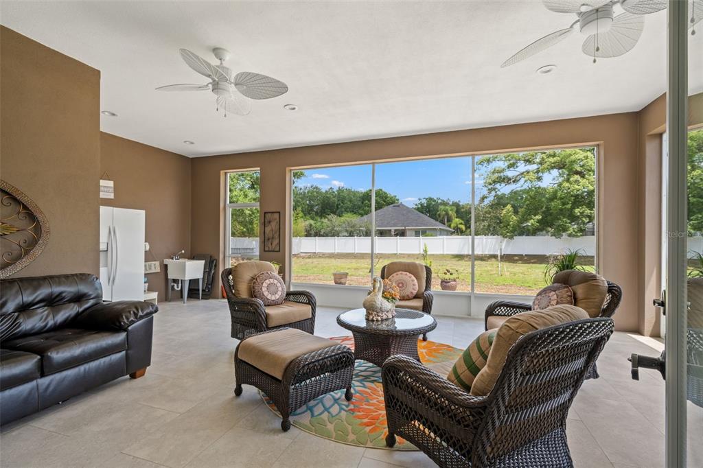 17601 Hanna Road Lutz, FL 33549 - Photo 37 of 48 a living room with furniture and a large window