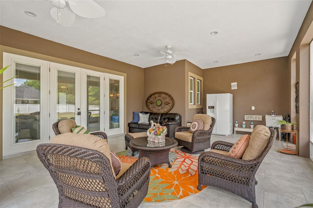 17601 Hanna Road Lutz, FL 33549 - Photo 38 of 48 a living room with furniture a rug and a large window