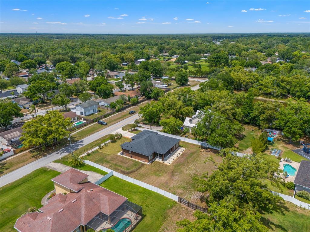 17601 Hanna Road Lutz, FL 33549 - Photo 44 of 48 an aerial view of residential houses with outdoor space and street view