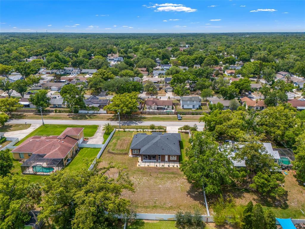 17601 Hanna Road Lutz, FL 33549 - Photo 45 of 48 an aerial view of residential houses with outdoor space and swimming pool