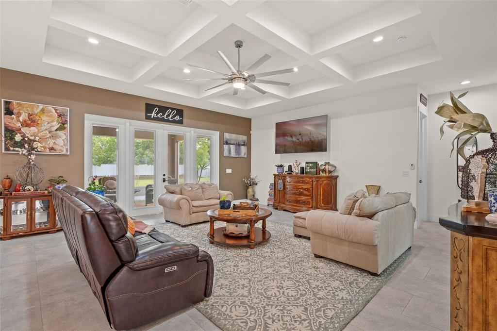 17601 Hanna Road Lutz, FL 33549 - Photo 8 of 48 a living room with furniture and a flat screen tv