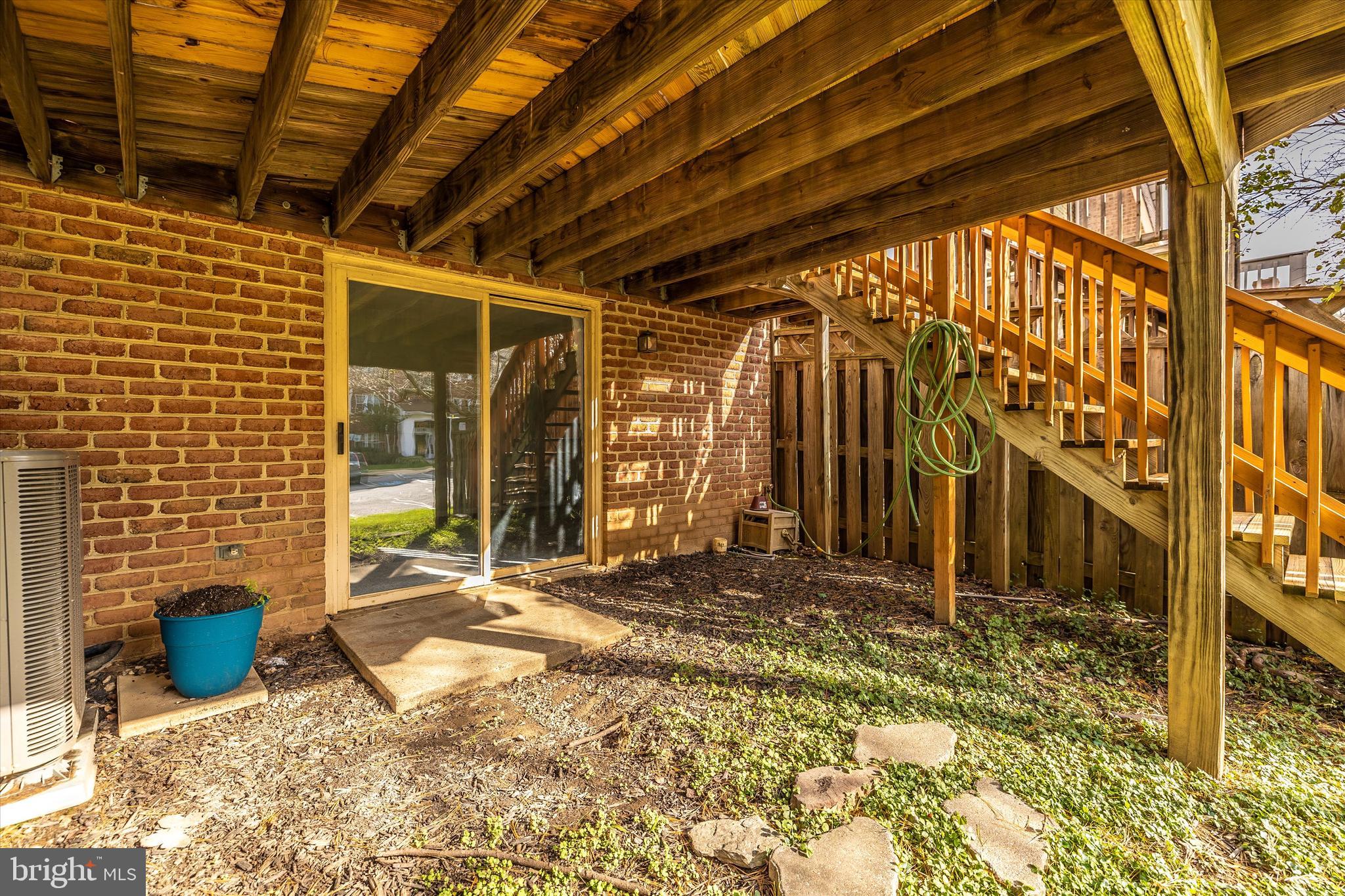 8001 Hollow Reed Court Frederick, MD 21701 - Photo 5 of 33 a view of a wooden door with an outdoor space
