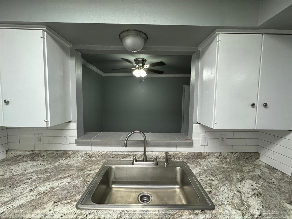 7000 Creswell Road, Unit 124 Shreveport, LA 71106 - Photo 13 of 18 a kitchen with a sink and cabinets