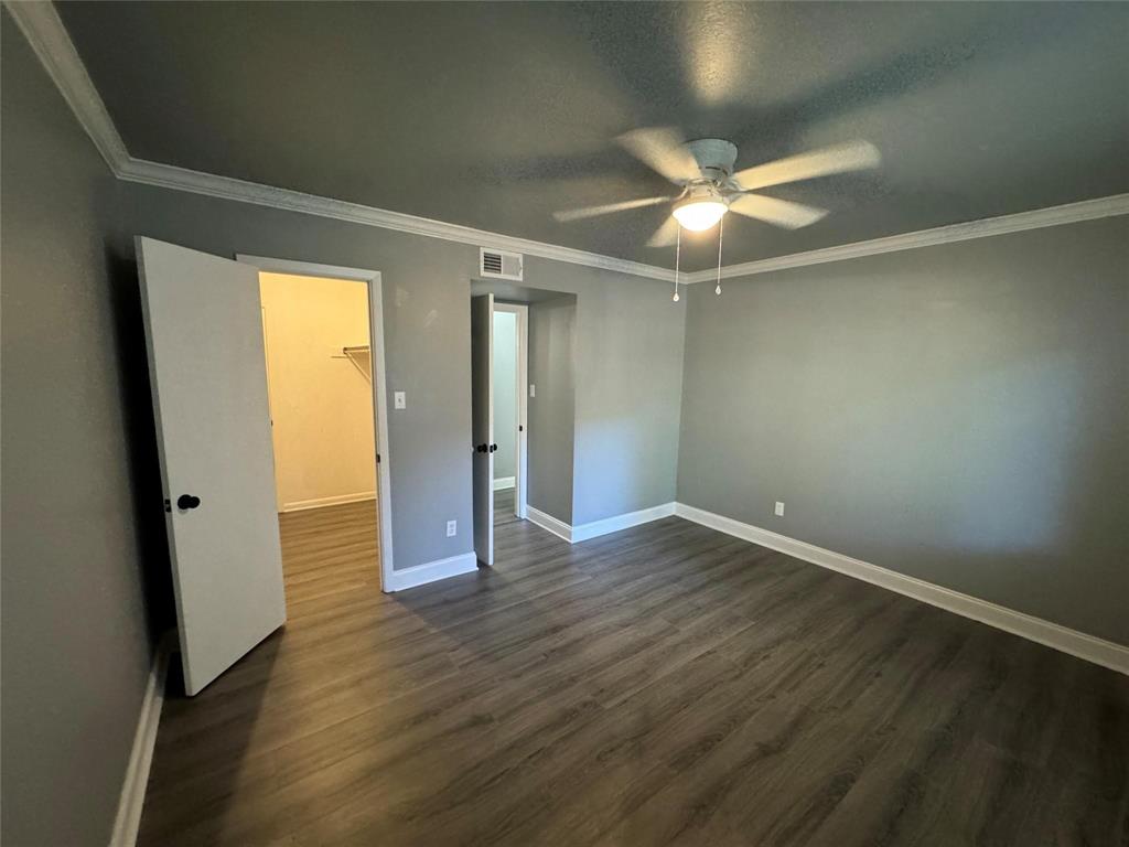 7000 Creswell Road, Unit 124 Shreveport, LA 71106 - Photo 15 of 18 an empty room with wooden floor and door