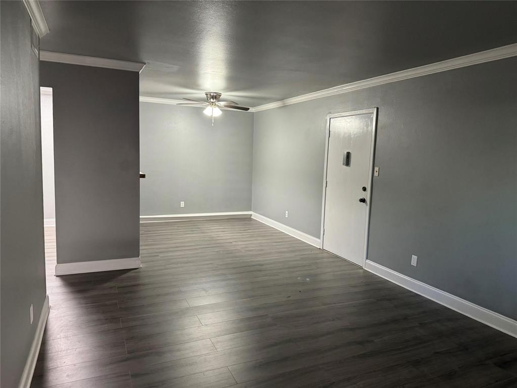 7000 Creswell Road, Unit 124 Shreveport, LA 71106 - Photo 6 of 18 an empty room with wooden floor and windows