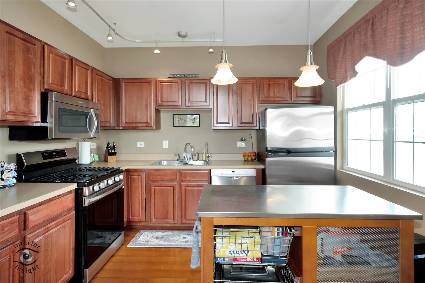 1366 Fox Hound Trail Beecher, IL 60401 - Photo 9 of 26 a kitchen with kitchen island granite countertop a stove a sink and a microwave