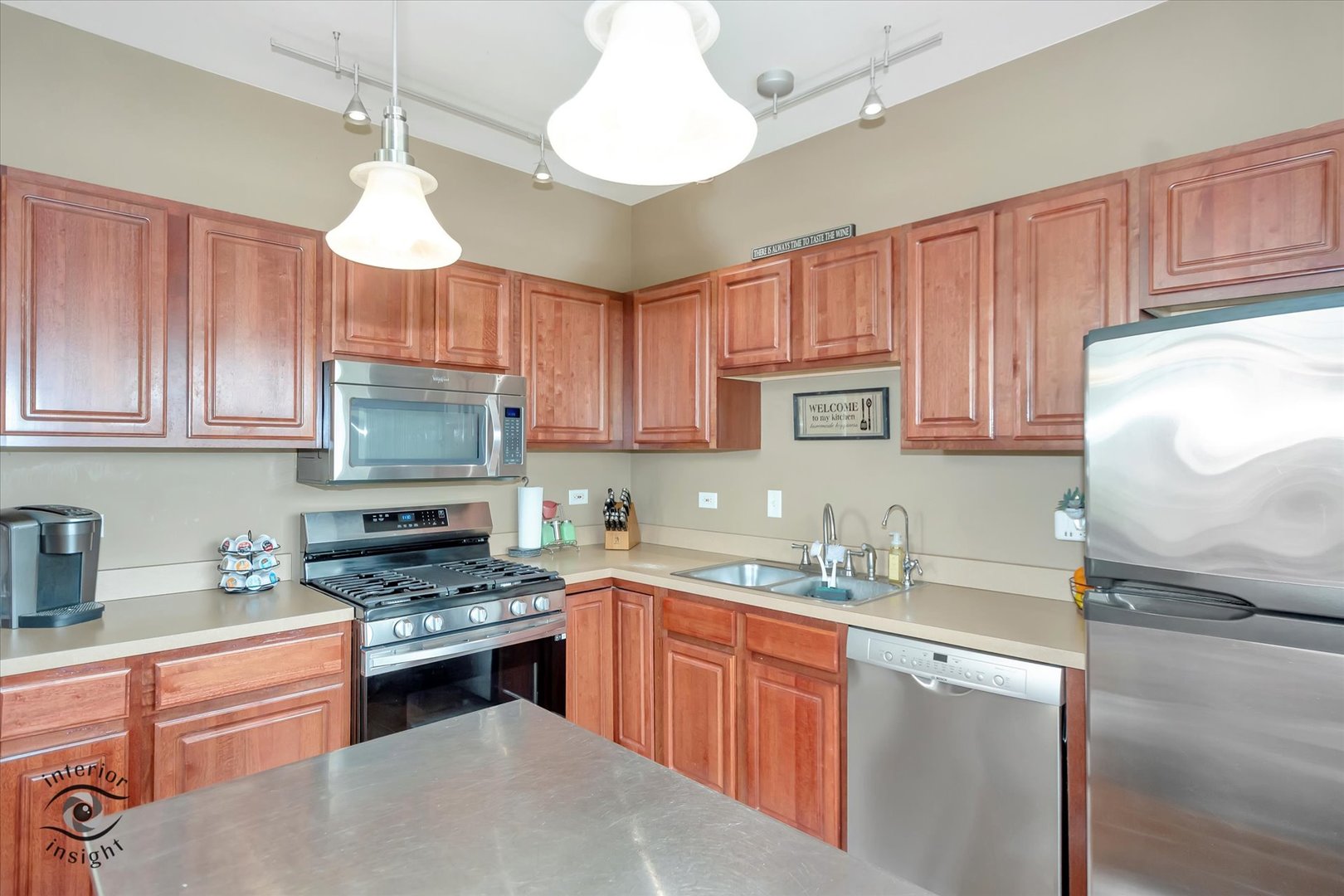 1366 Fox Hound Trail Beecher, IL 60401 - Photo 10 of 26 a kitchen with kitchen island granite countertop a sink cabinets stainless steel appliances and a counter space