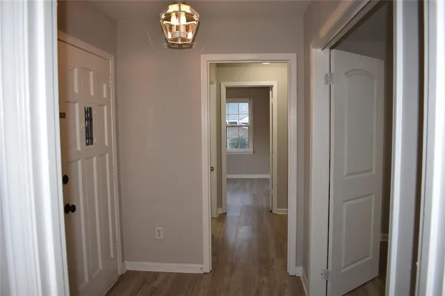 a view of closet with windows