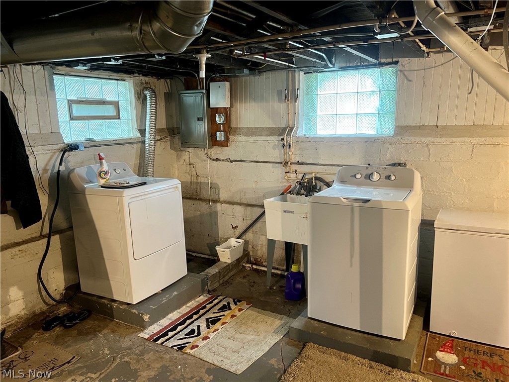 1714 Hillview Road Cleveland, OH 44112 - Photo 13 of 17 Clothes washing area featuring separate washer and dryer and electric panel