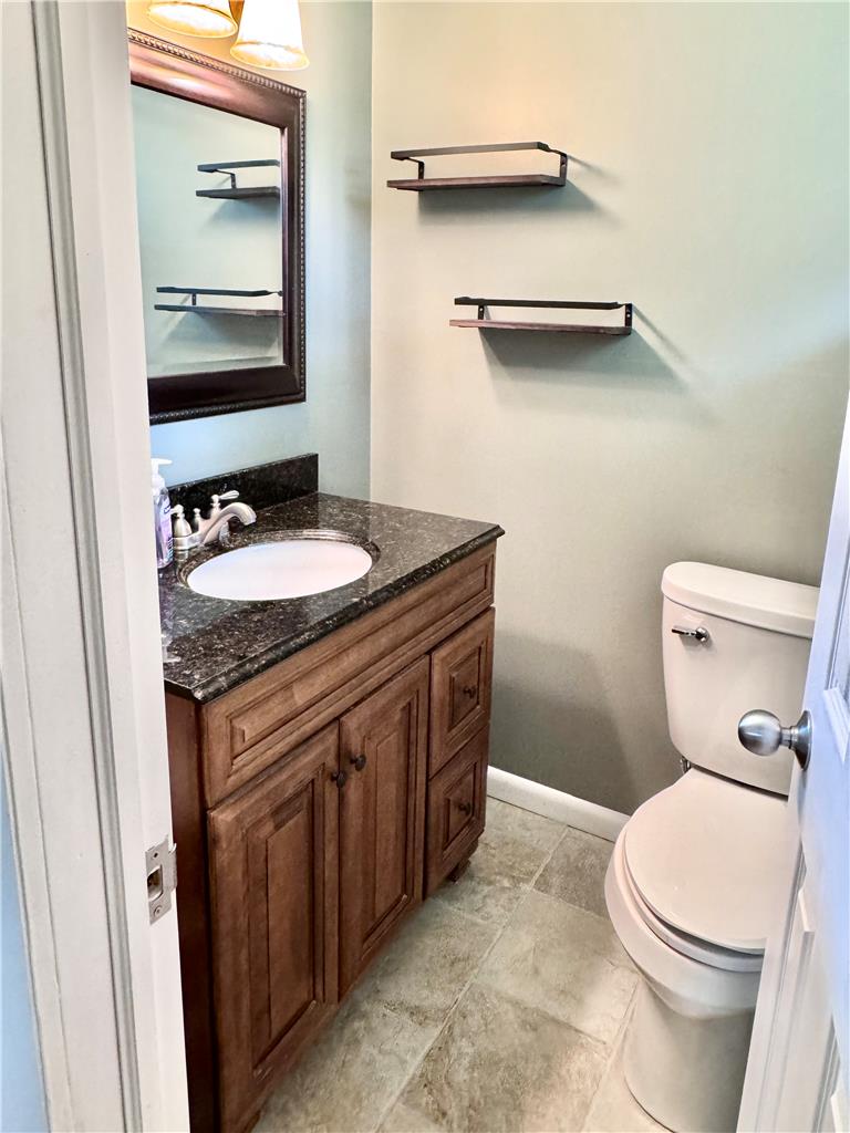 5334 Egypt Road Laurys Station, PA 18059 - Photo 25 of 55 A well-appointed bathroom features a dark granite countertop and practical tile flooring.