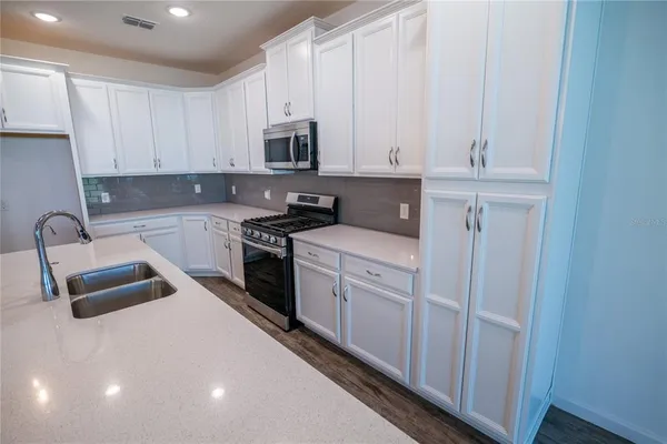 a view of cabinets and wooden floor