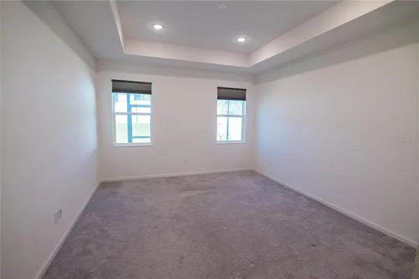 a view of storage and utility room with closet
