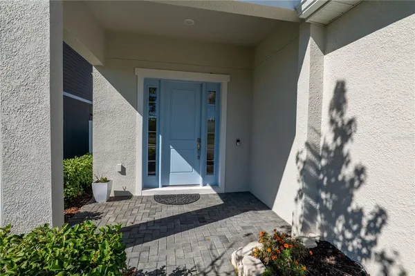 a view of a room with wooden floor and window