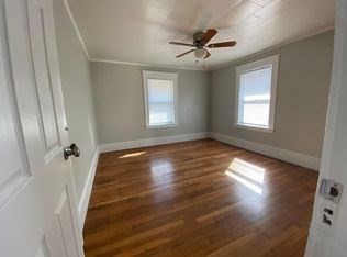 157-167 Delhi Street Boston, MA 02126 - Photo 8 of 16 a view of a livingroom with wooden floor and a window