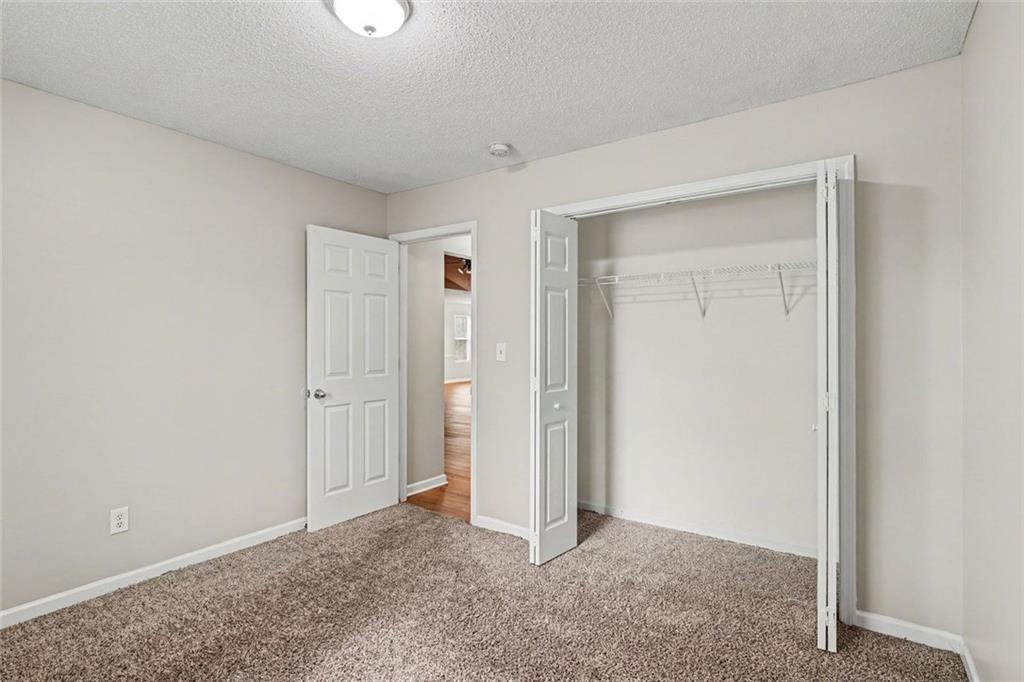 85 Homestead Place Rex, GA 30273 - Photo 11 of 17 a view of an empty room and closet area