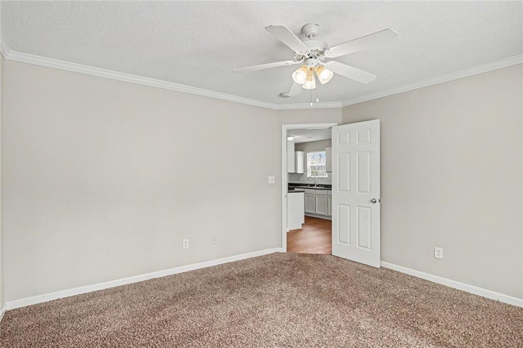 85 Homestead Place Rex, GA 30273 - Photo 13 of 17 an empty room with closet and windows