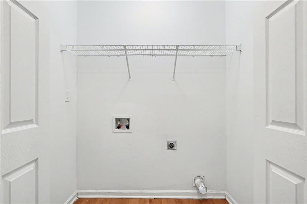 85 Homestead Place Rex, GA 30273 - Photo 16 of 17 a view of a room with racks on the wall