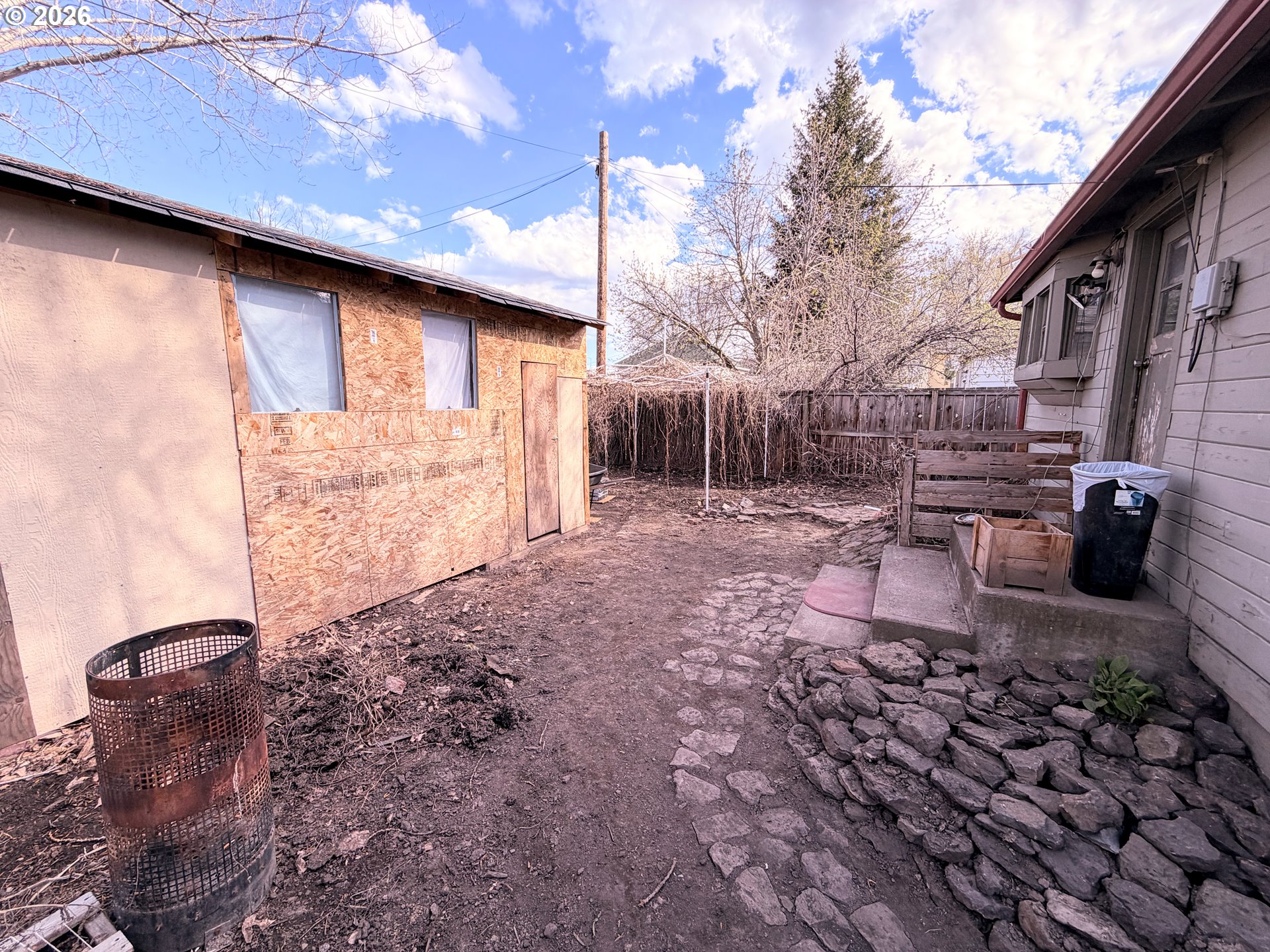 1207 10th Street La Grande, OR 97850 - Photo 11 of 13 a backyard of a house with lots of green space