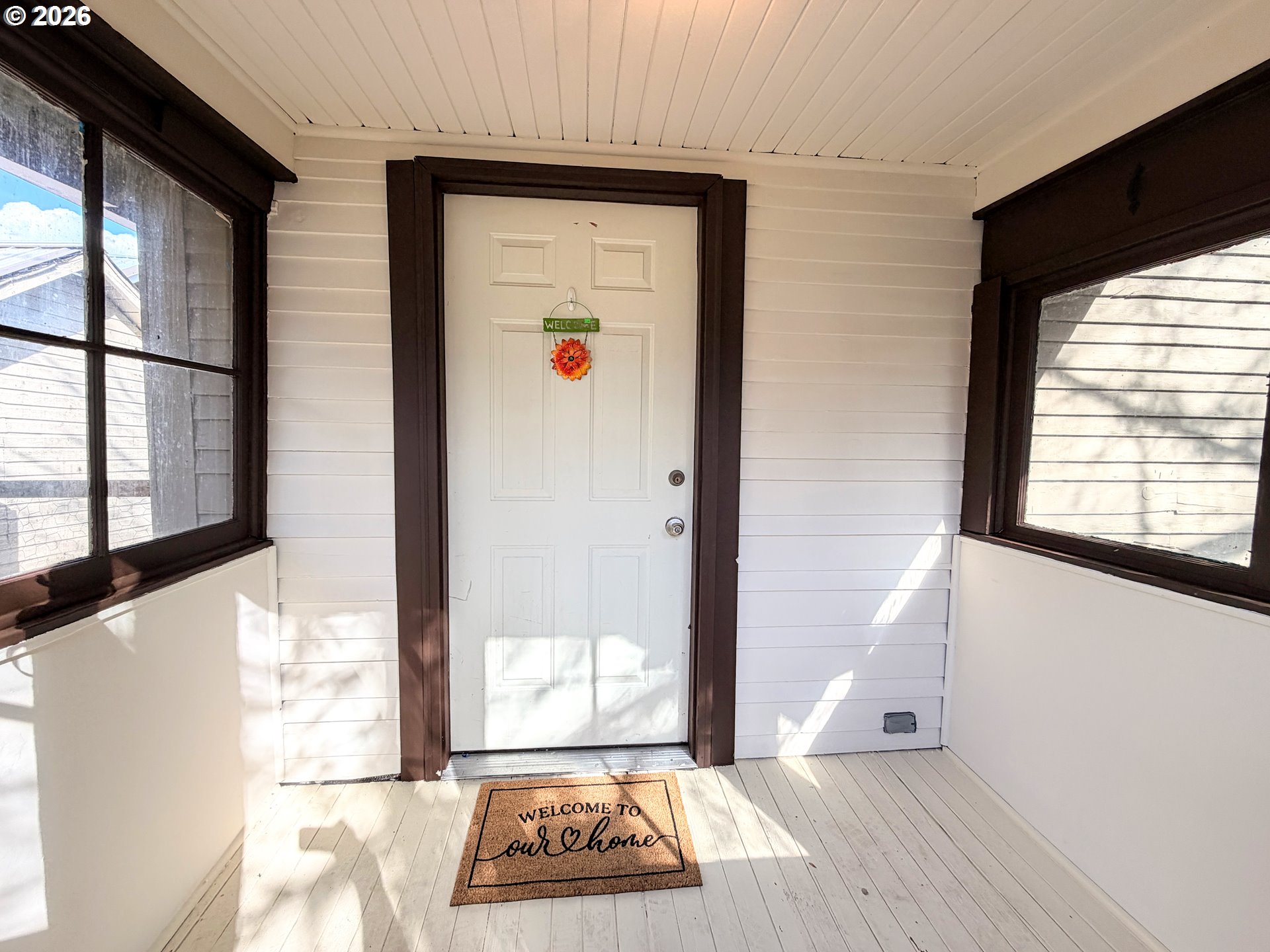 1207 10th Street La Grande, OR 97850 - Photo 2 of 13 a view of an entryway with wooden floor and door
