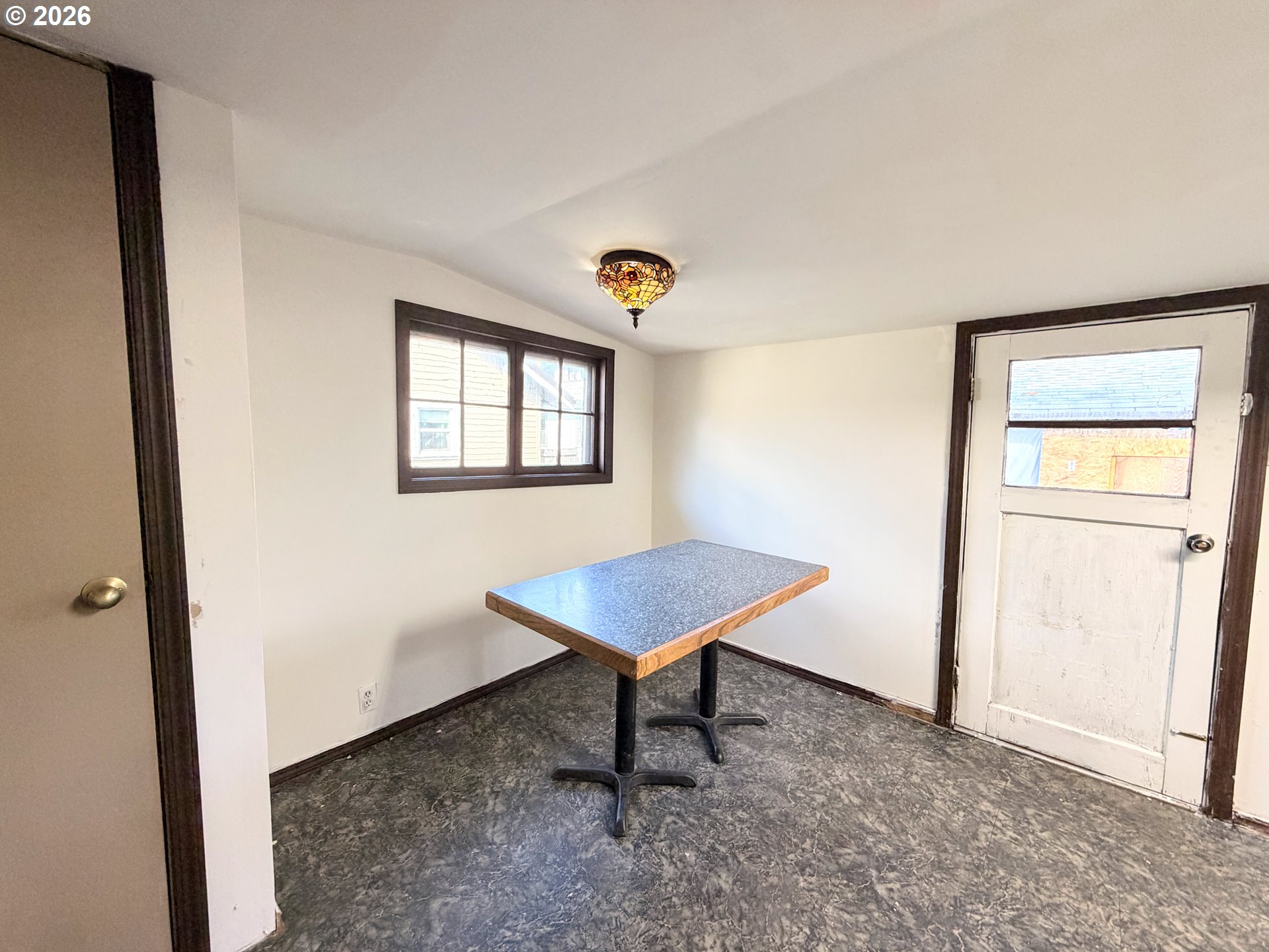 1207 10th Street La Grande, OR 97850 - Photo 5 of 13 a view of a room with a window and a ceiling fan