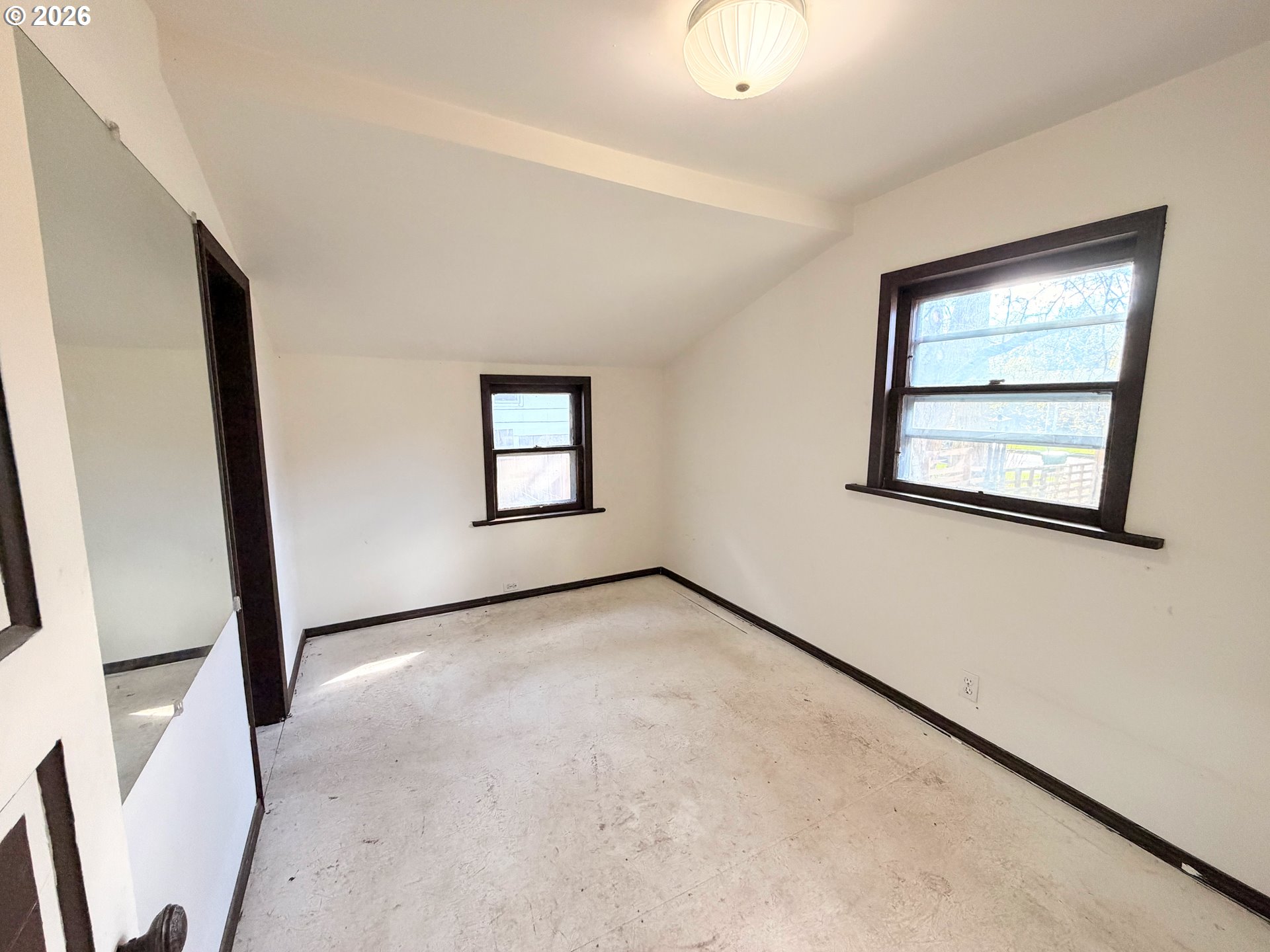 1207 10th Street La Grande, OR 97850 - Photo 7 of 13 a view of an empty room with a window