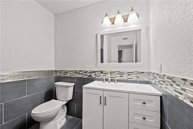 a bathroom with a glass door shower