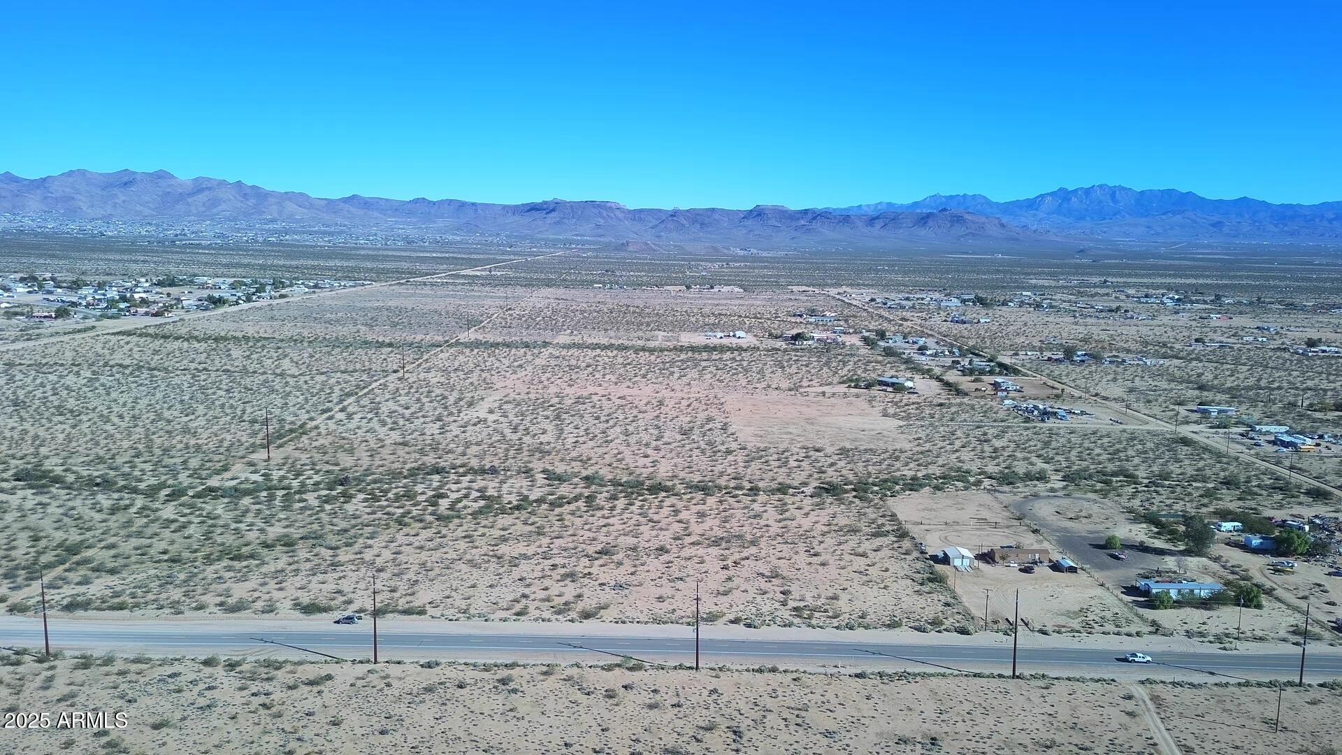 1152 Colorado Road Golden Valley, AZ 86413 - Photo 16 of 47 a view of a yard with a large tree