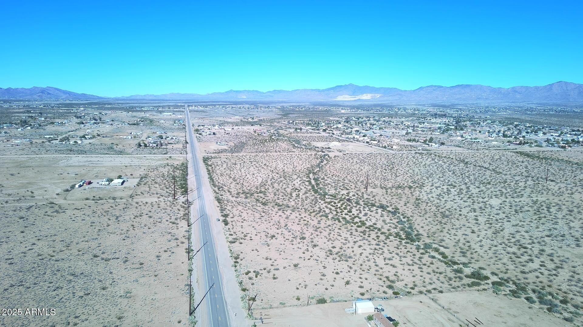 1152 Colorado Road Golden Valley, AZ 86413 - Photo 19 of 47 a view of a beach with a mountain