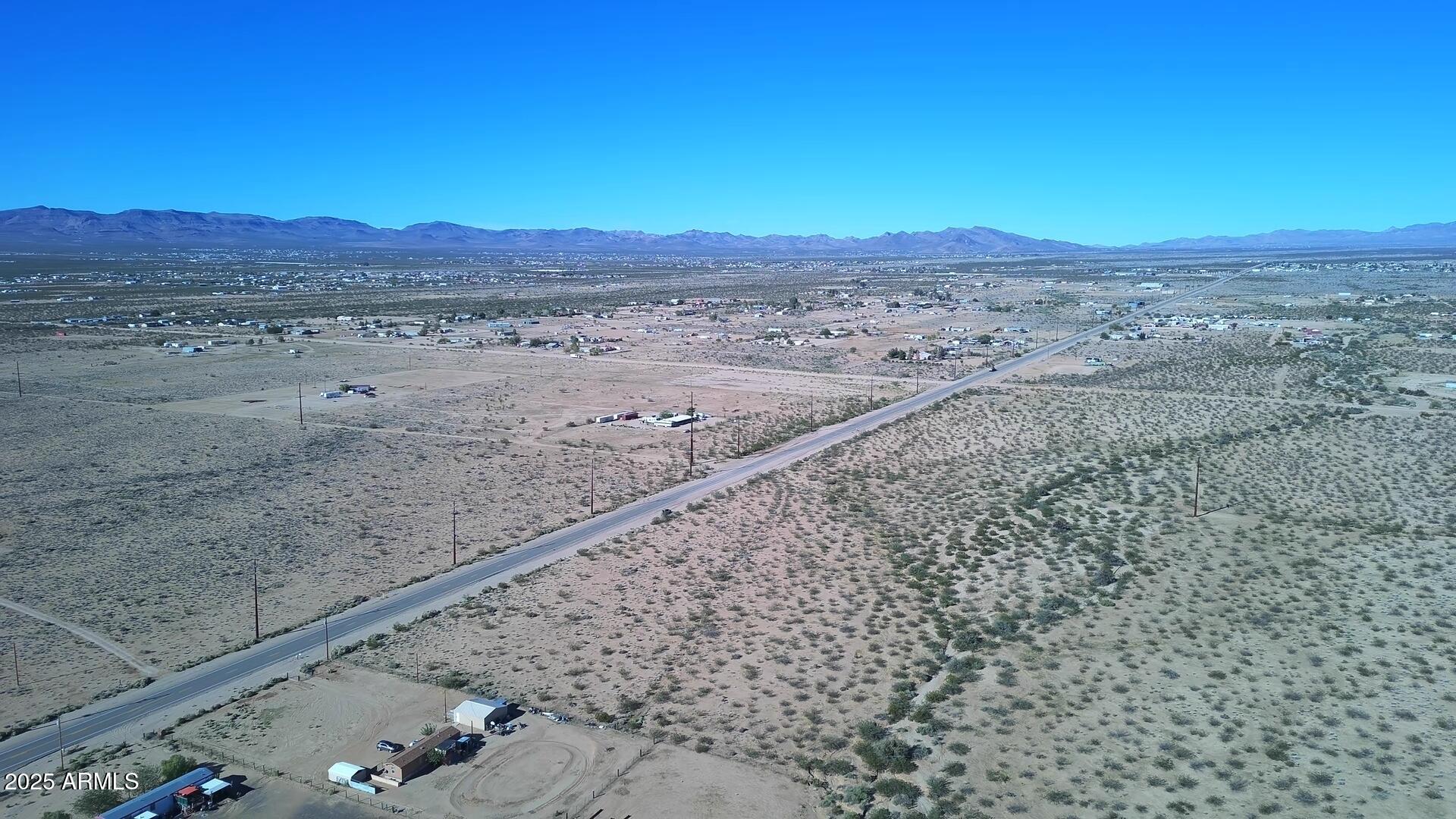 1152 Colorado Road Golden Valley, AZ 86413 - Photo 20 of 47 a view of a yard with a mountain