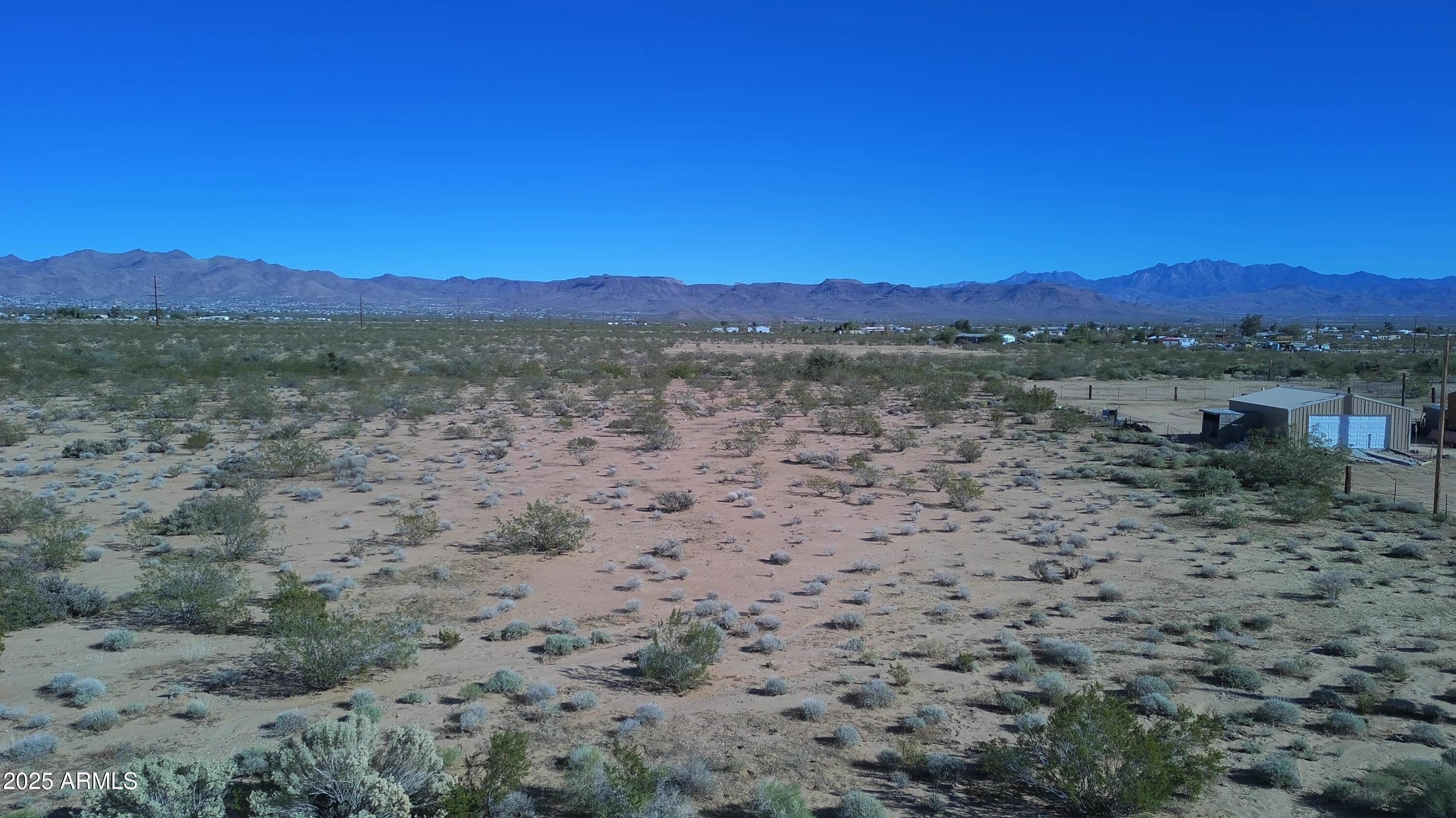 1152 Colorado Road Golden Valley, AZ 86413 - Photo 26 of 47 a view of a lake with a mountain in the background