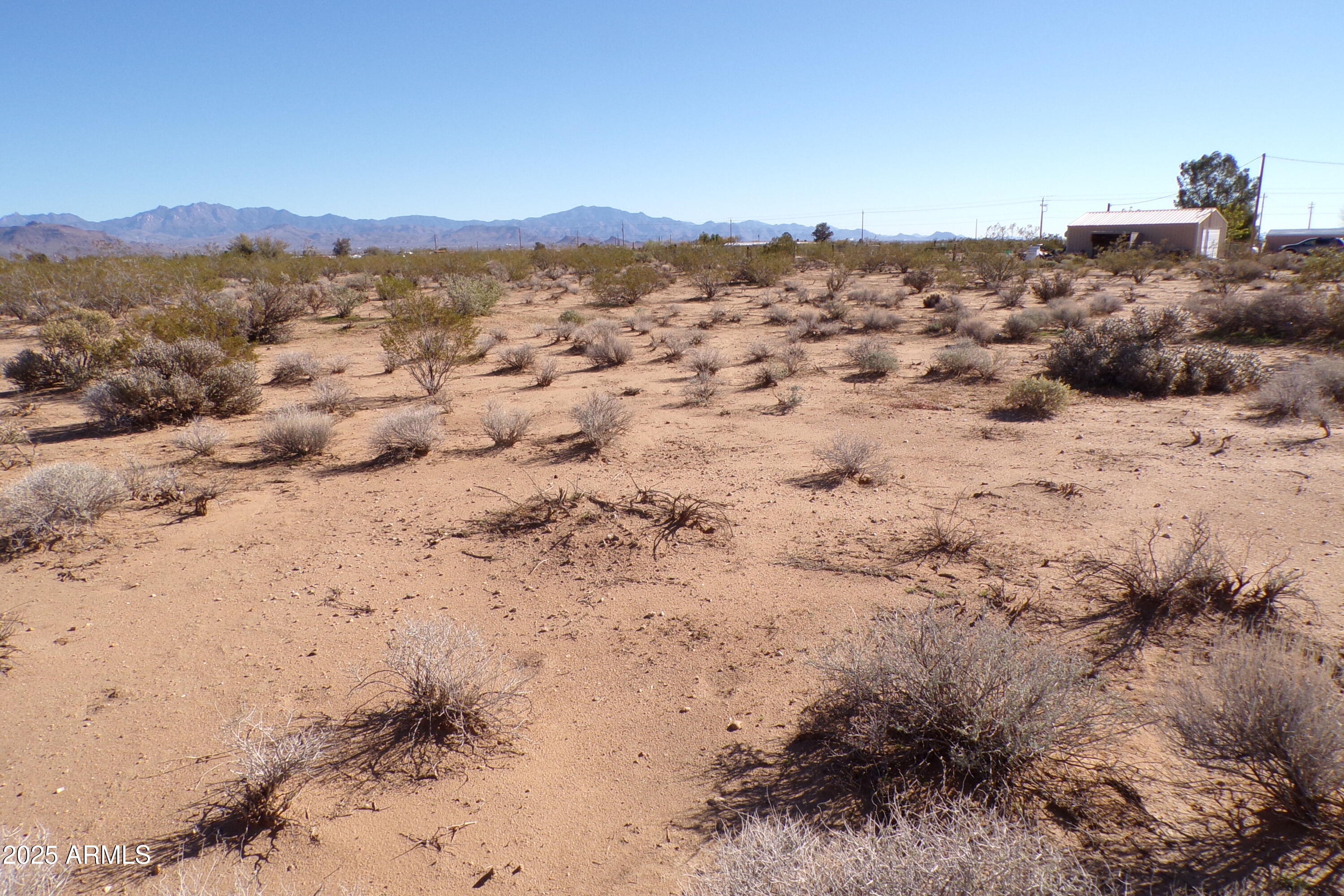 1152 Colorado Road Golden Valley, AZ 86413 - Photo 38 of 47 a view of a beach with a mountain