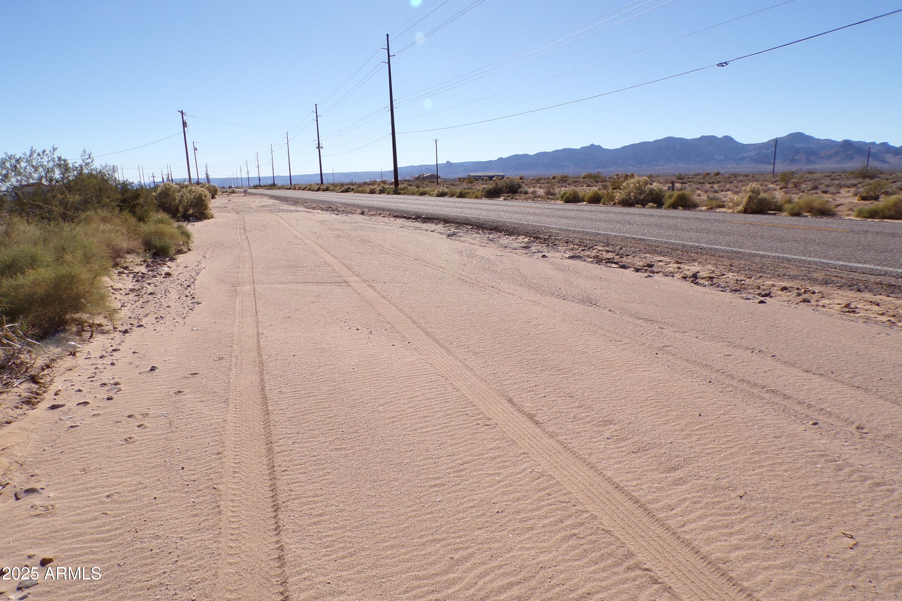 1152 Colorado Road Golden Valley, AZ 86413 - Photo 4 of 47 a view of a road with an ocean view