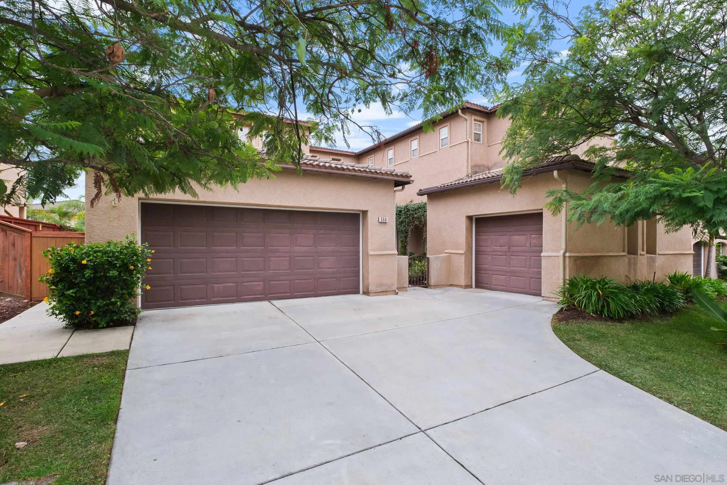 550 Echo Lane San Marcos, CA 92078 - Photo 2 of 51 a backyard of a house with plants and trees